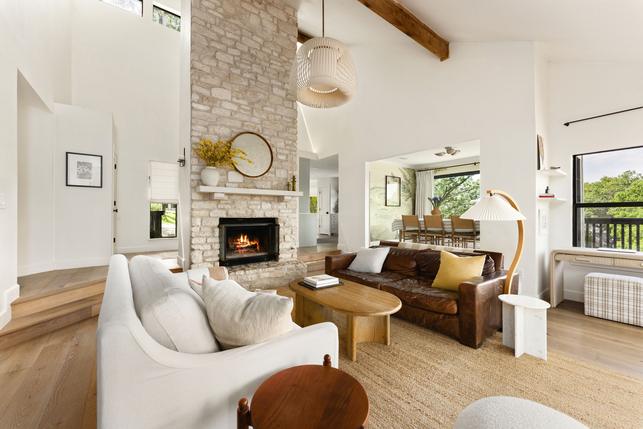 9101 Echo Point Cove Austin, TX 78759 - Photo 6 of 34 a living room with furniture a flat screen tv and a fireplace
