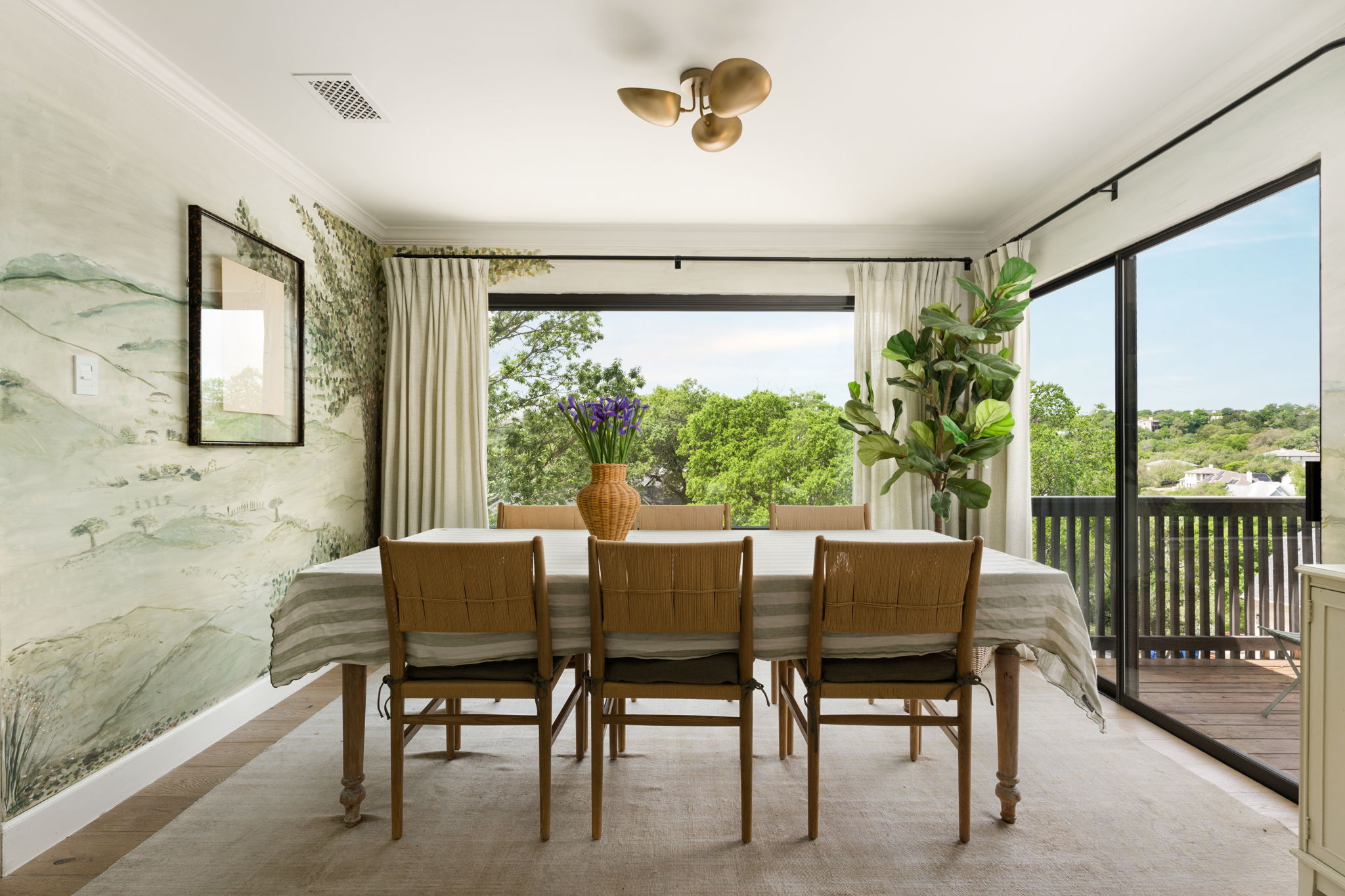 9101 Echo Point Cove Austin, TX 78759 - Photo 10 of 34 a dining room with furniture a chandelier and a floor to ceiling window