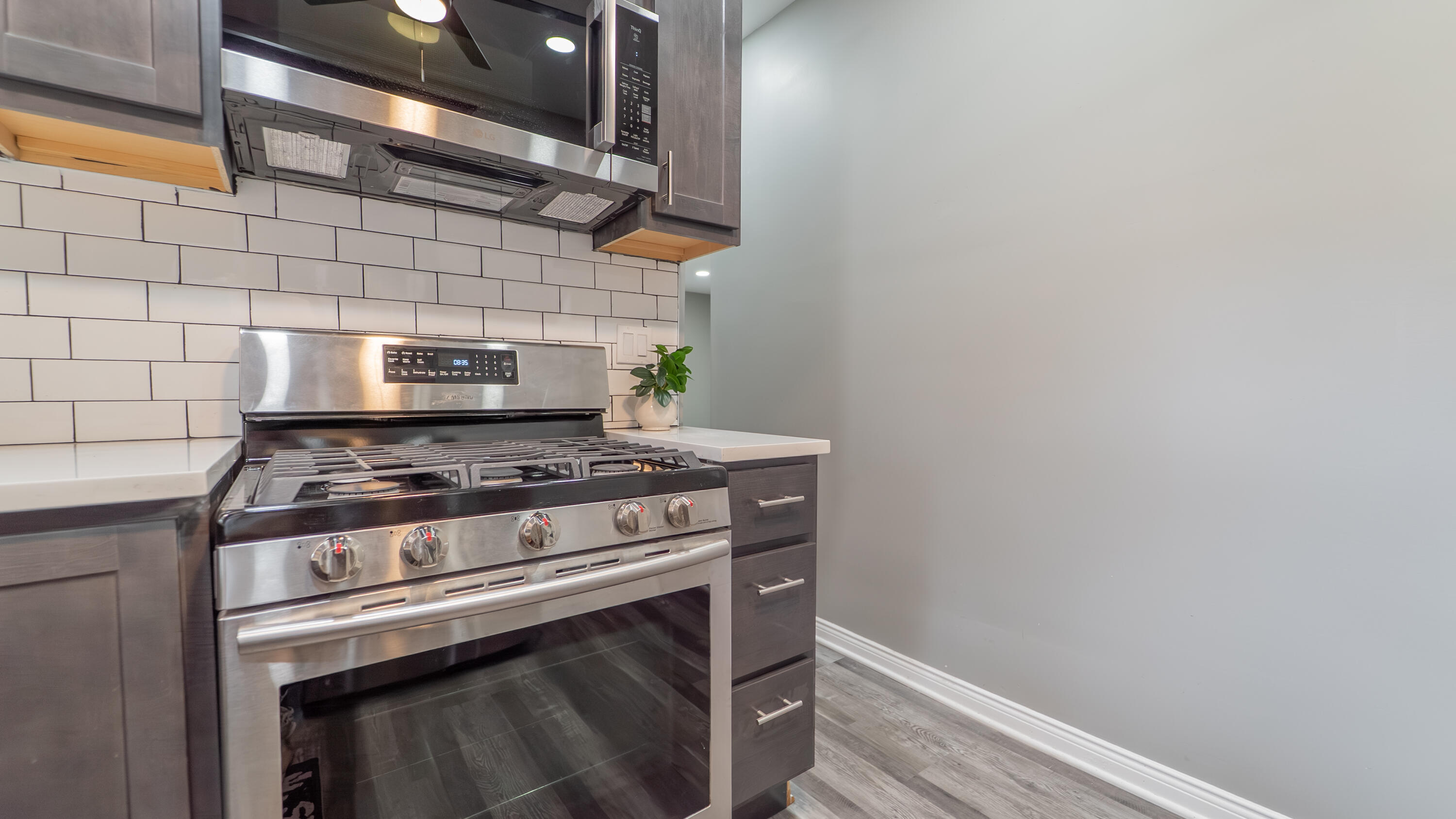 2257 West 16th Avenue Gary, IN 46404 - Photo 12 of 24 a stove top oven sitting inside of a kitchen