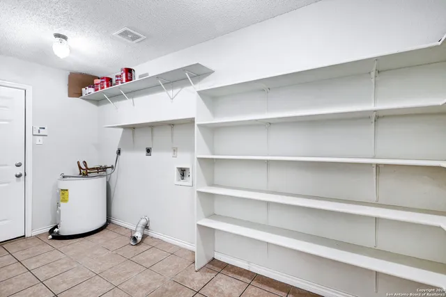 a view of storage and utility room with washer and dryer