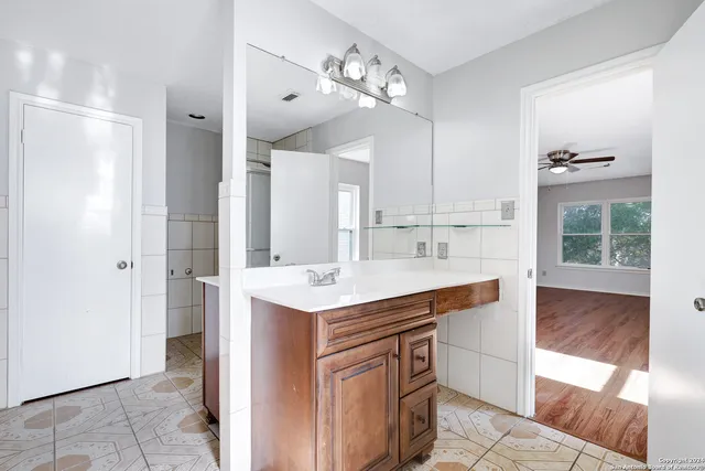 a view of kitchen with sink refrigerator and microwave