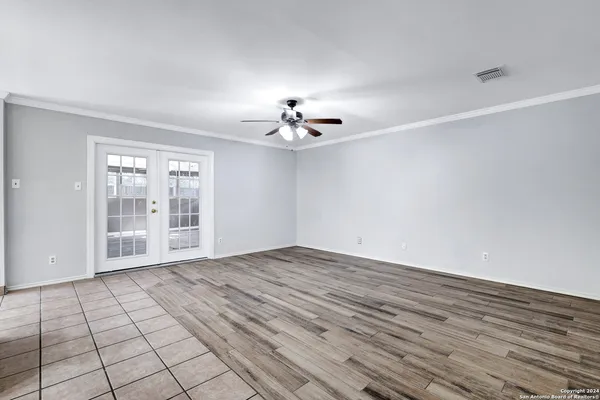 a view of an empty room with a window