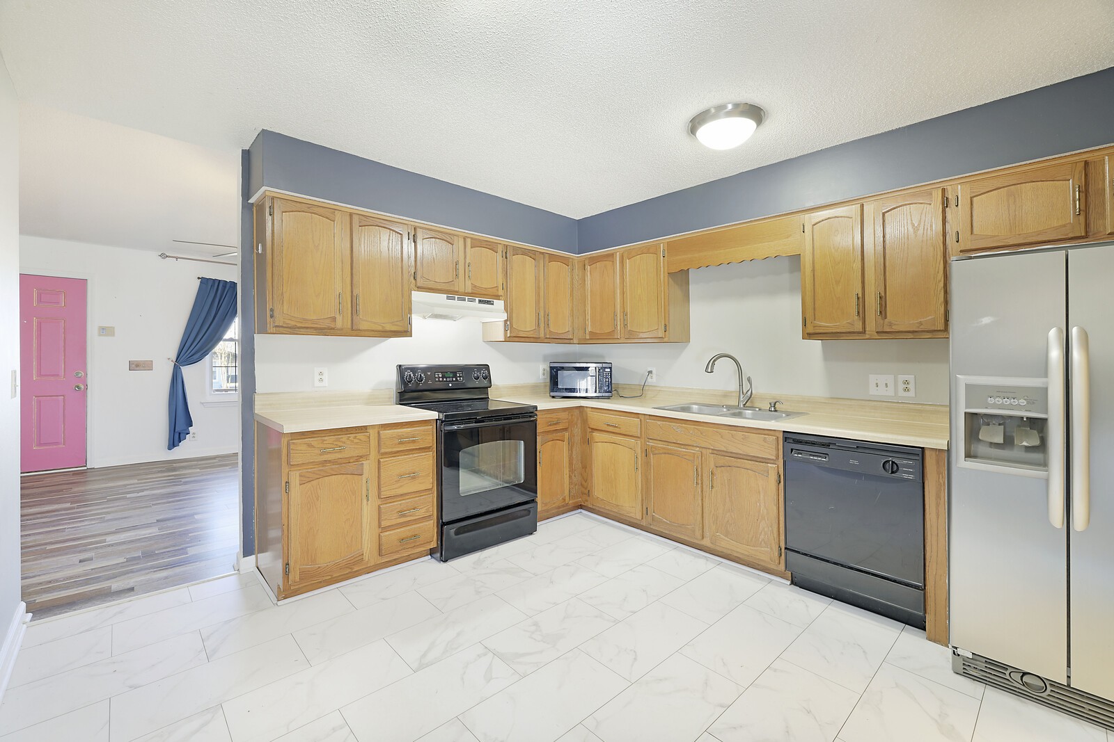 185 Bonnafield Drive Hermitage, TN 37076 - Photo 15 of 42 a kitchen with stainless steel appliances granite countertop a refrigerator sink and stove