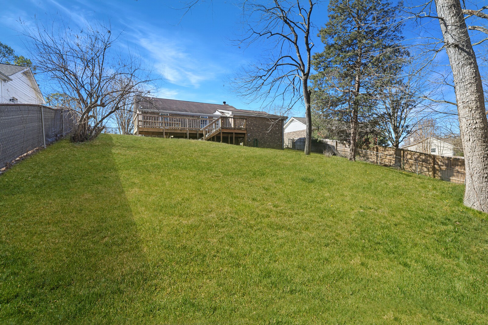 185 Bonnafield Drive Hermitage, TN 37076 - Photo 41 of 42 a yellow house sitting in middle of the grass
