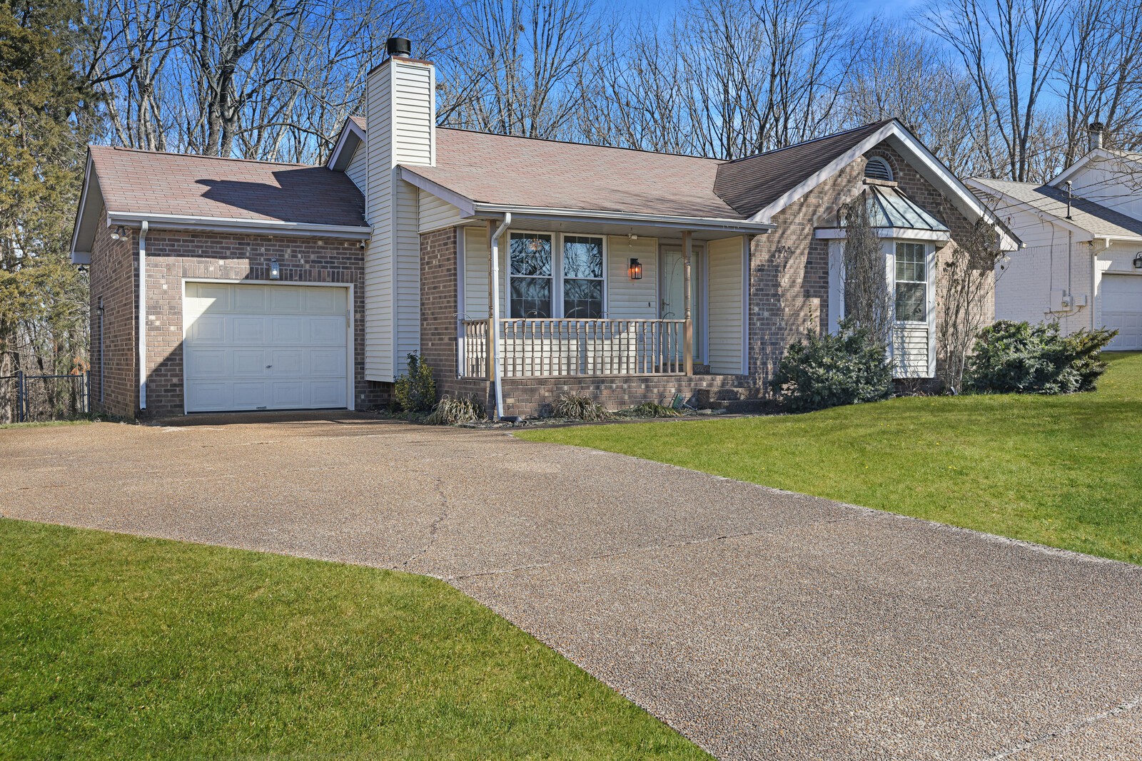 185 Bonnafield Drive Hermitage, TN 37076 - Photo 6 of 42 a front view of a house with a yard and garage