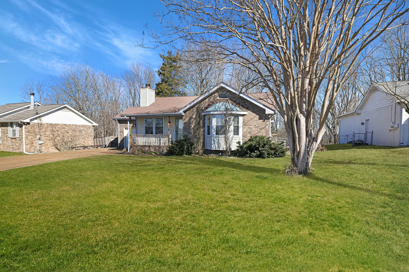 185 Bonnafield Drive Hermitage, TN 37076 - Photo 7 of 42 a view of a house next to a big yard and large trees