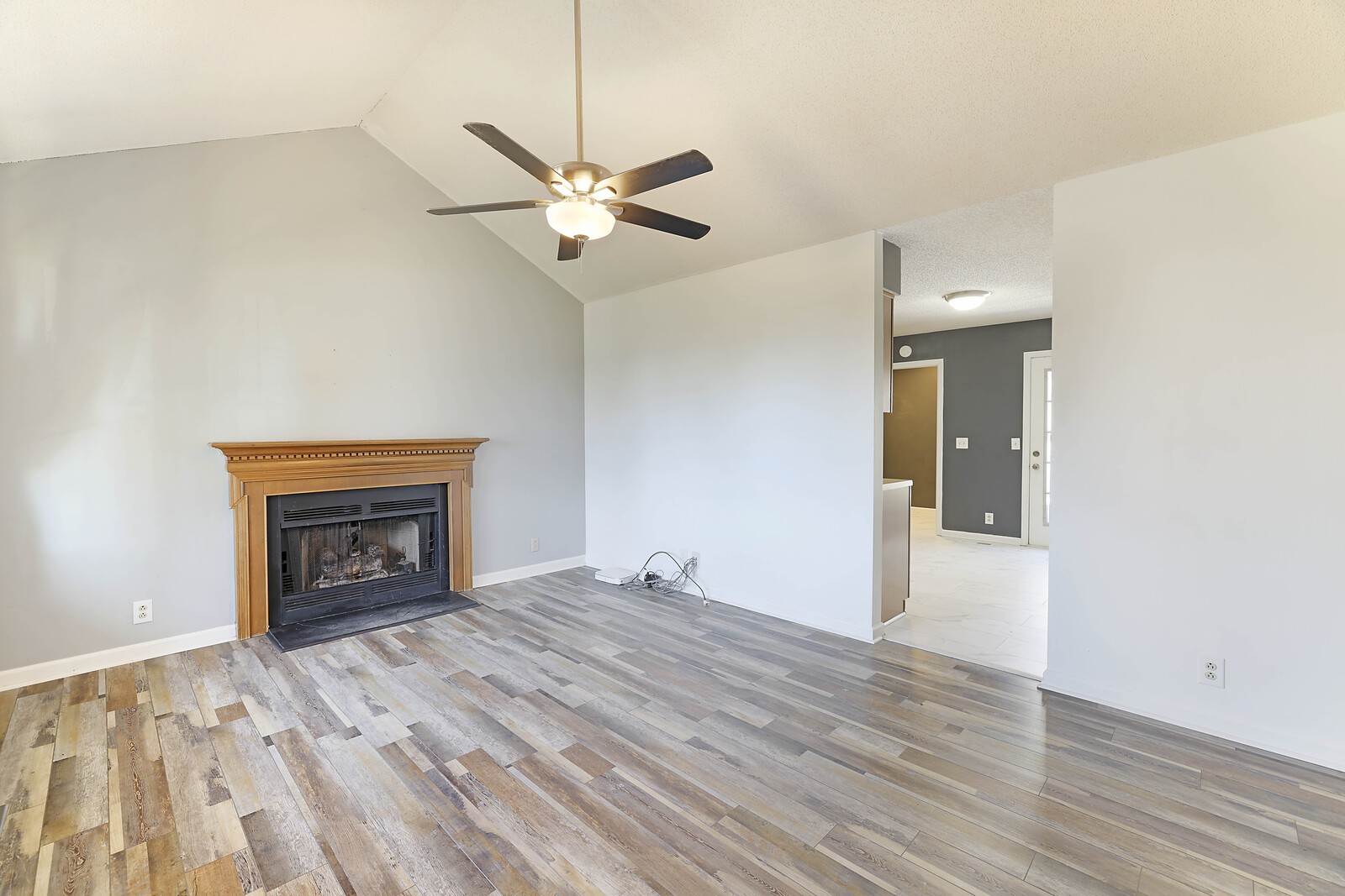 185 Bonnafield Drive Hermitage, TN 37076 - Photo 10 of 42 an empty room with a fireplace and wooden floor