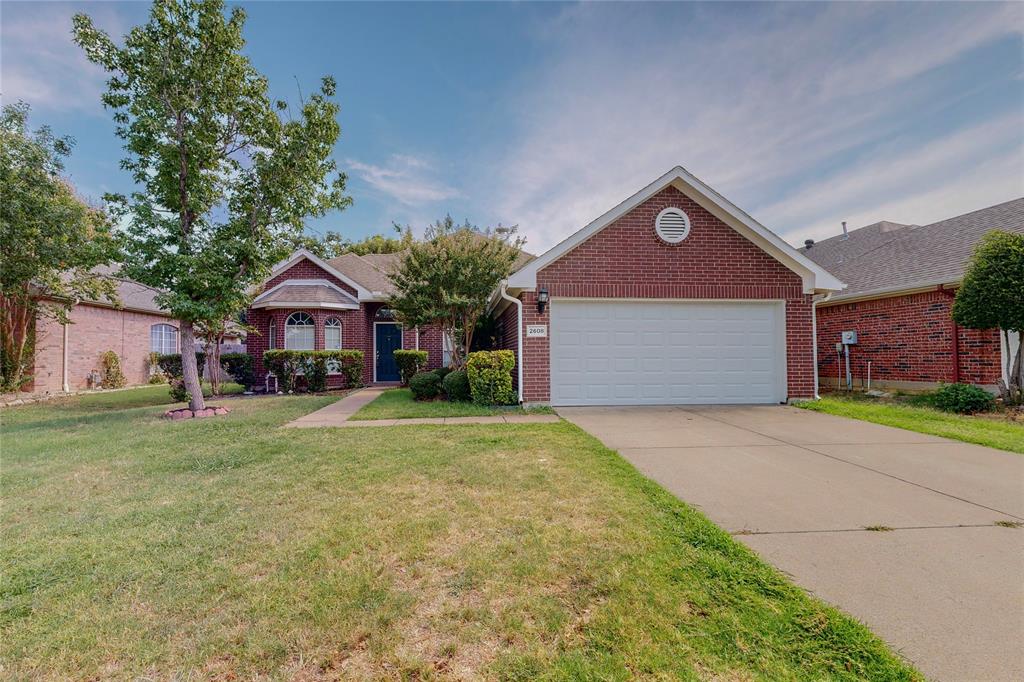 2608 Loon Lake Road Denton, TX 76210 - Photo 1 of 1 a front view of a house with a yard and garage