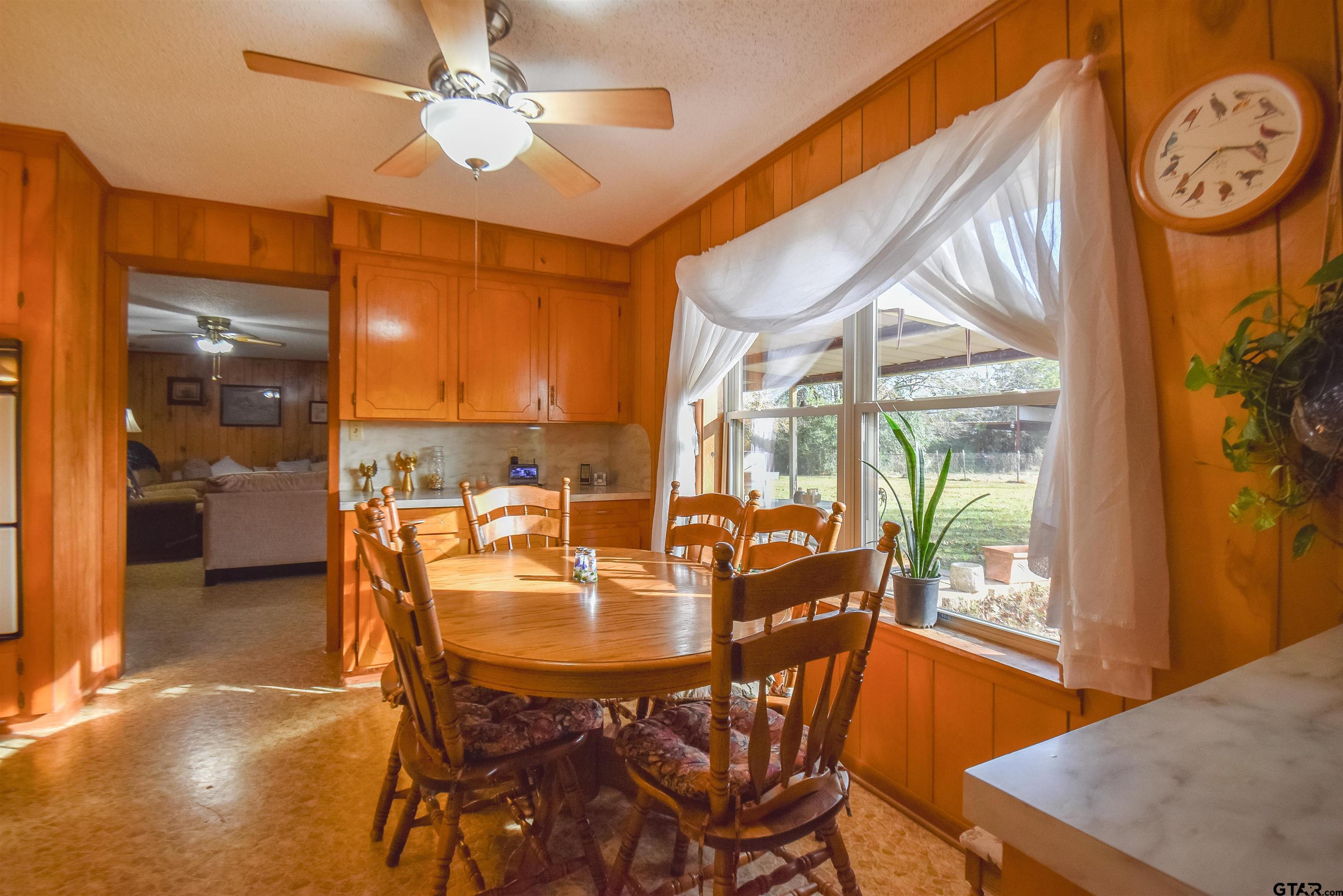 355 West Sugar Hill Road Reklaw, TX 75784 - Photo 11 of 38 a dining room with furniture and a floor to ceiling window