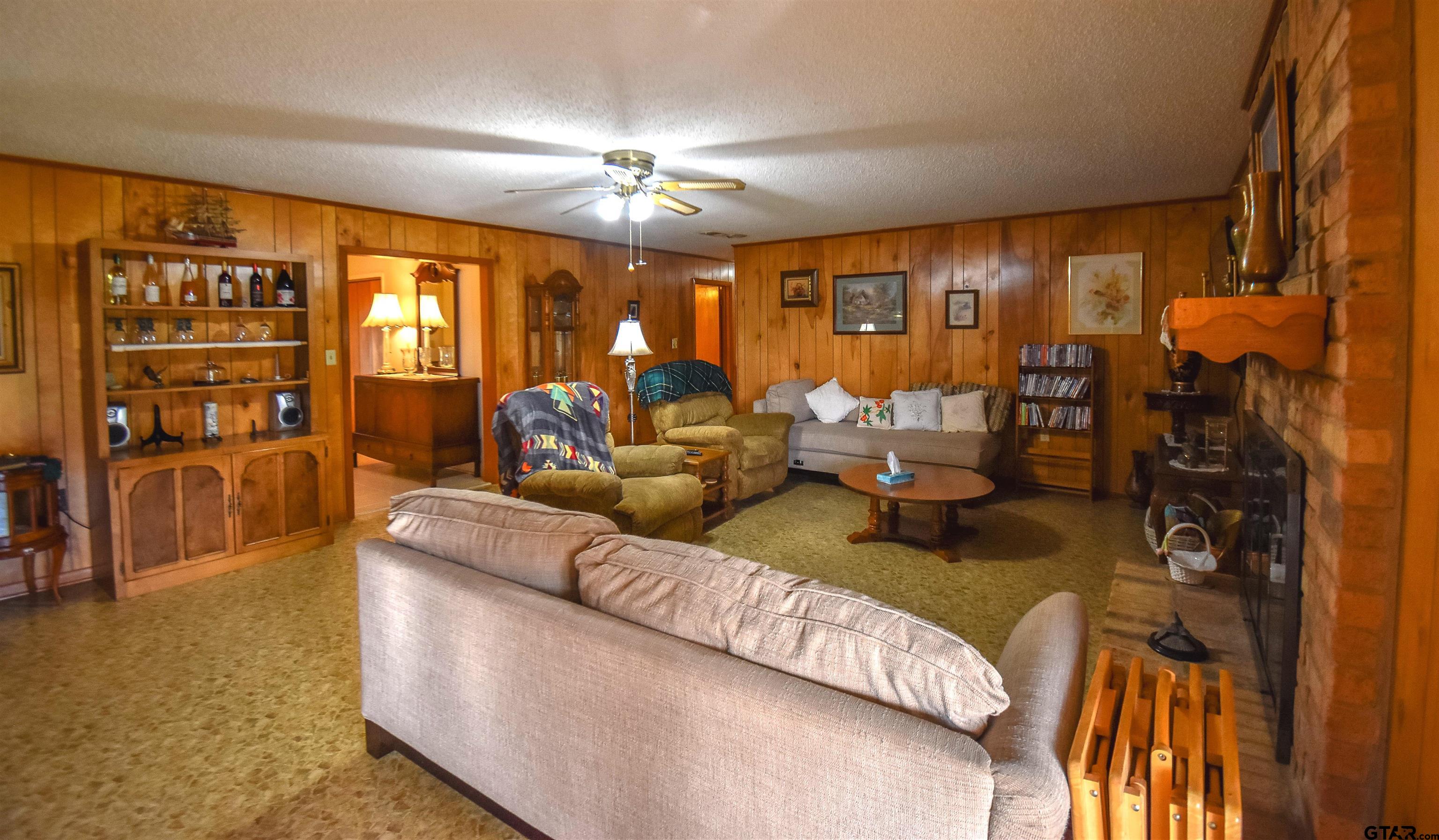 355 West Sugar Hill Road Reklaw, TX 75784 - Photo 13 of 38 a living room with furniture and chandelier