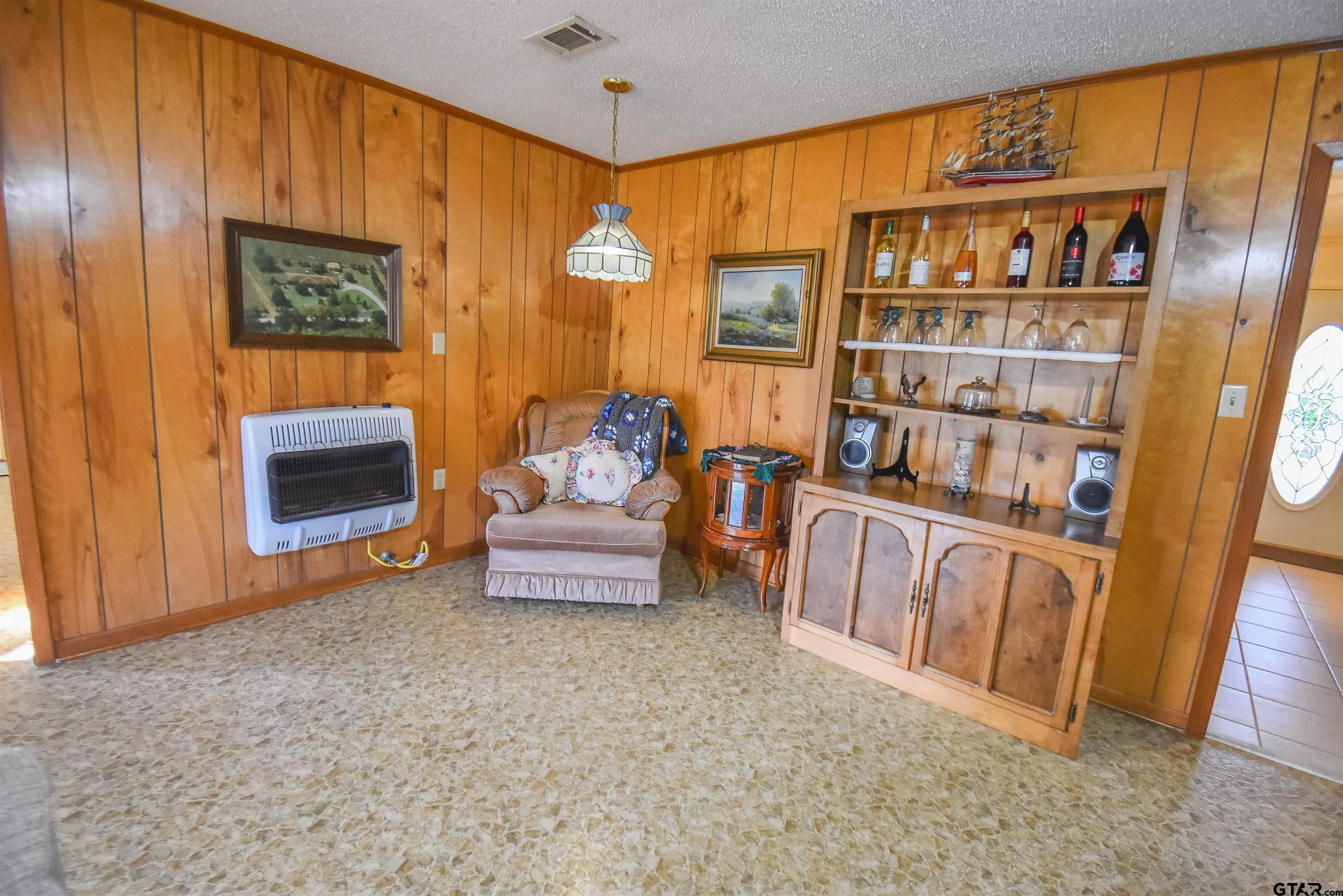 355 West Sugar Hill Road Reklaw, TX 75784 - Photo 14 of 38 a living room with furniture and a book shelf