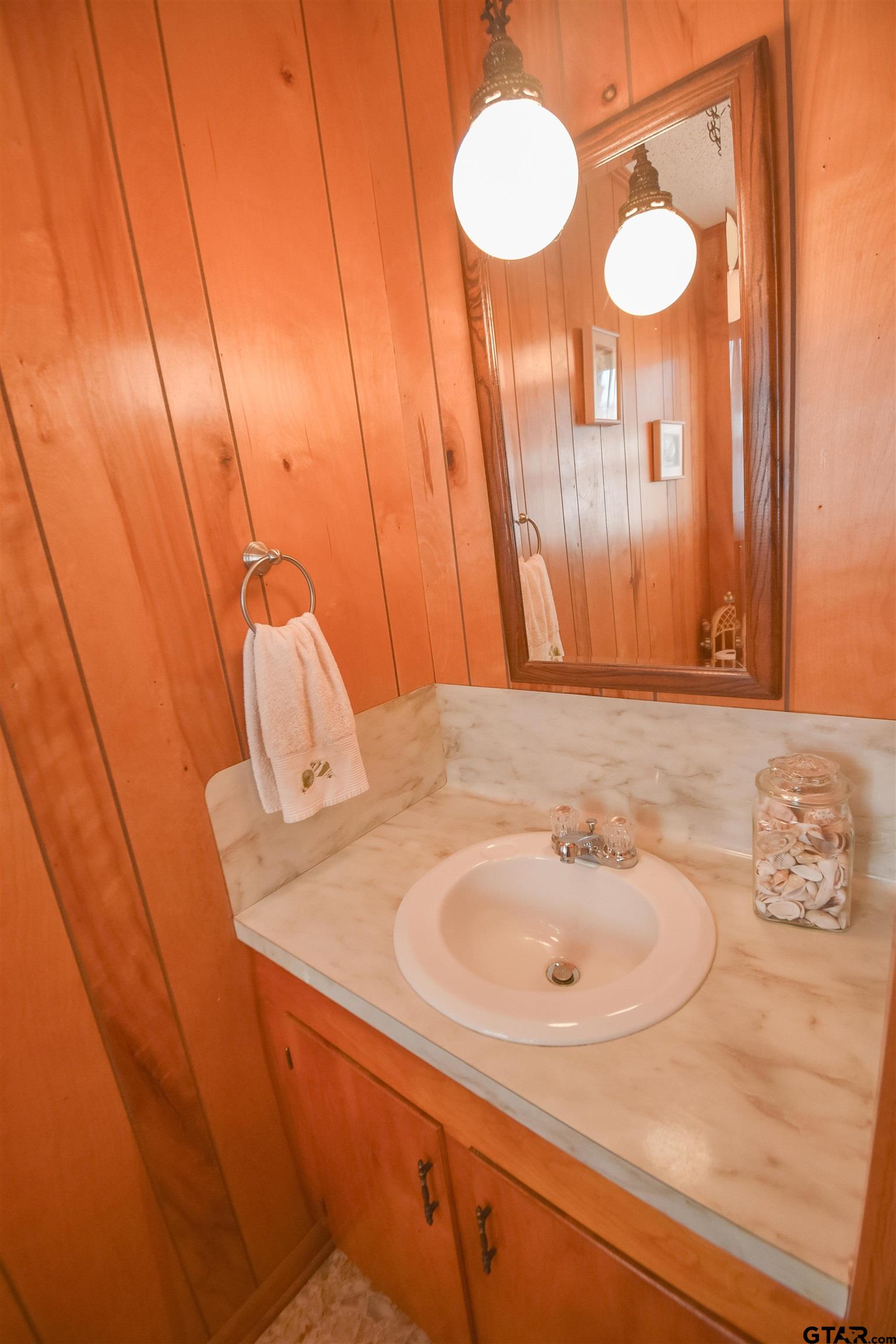 355 West Sugar Hill Road Reklaw, TX 75784 - Photo 32 of 38 a bathroom with a sink and a mirror