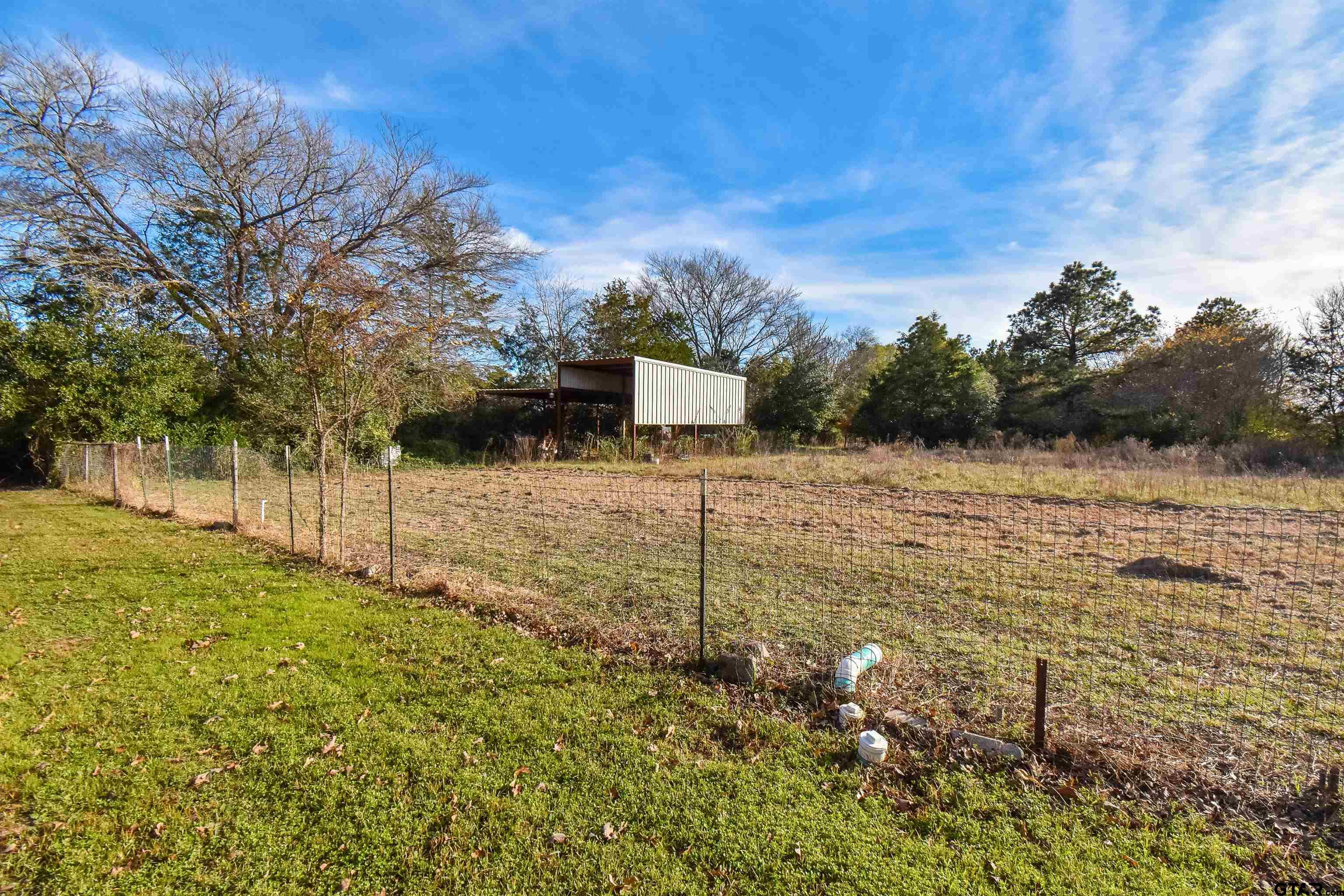 355 West Sugar Hill Road Reklaw, TX 75784 - Photo 34 of 38 a view of a pathway with a wrought fence