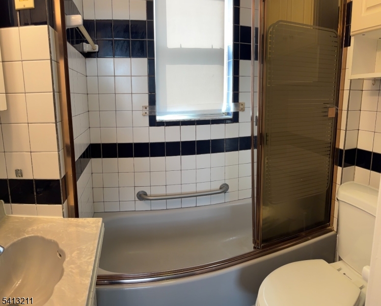 4 Wall Street, Unit 2 Cranford, NJ 07016 - Photo 9 of 12 a bathroom with a toilet and a shower