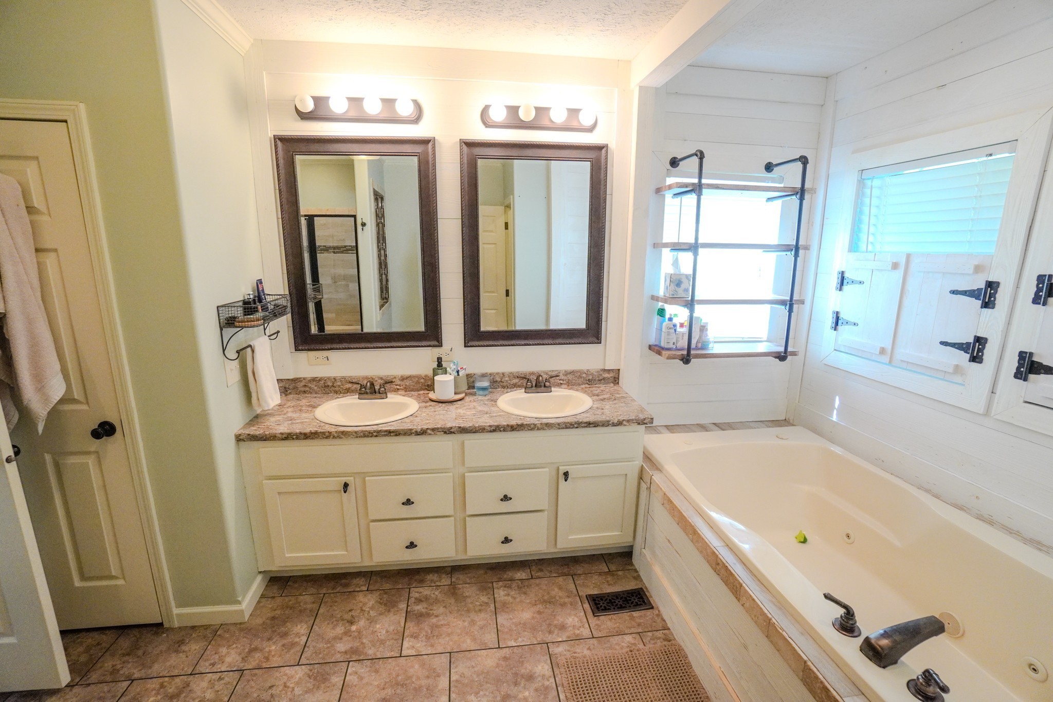137 Hawkins Road Westmoreland, TN 37186 - Photo 57 of 71 a bathroom with a granite countertop tub sink and mirror