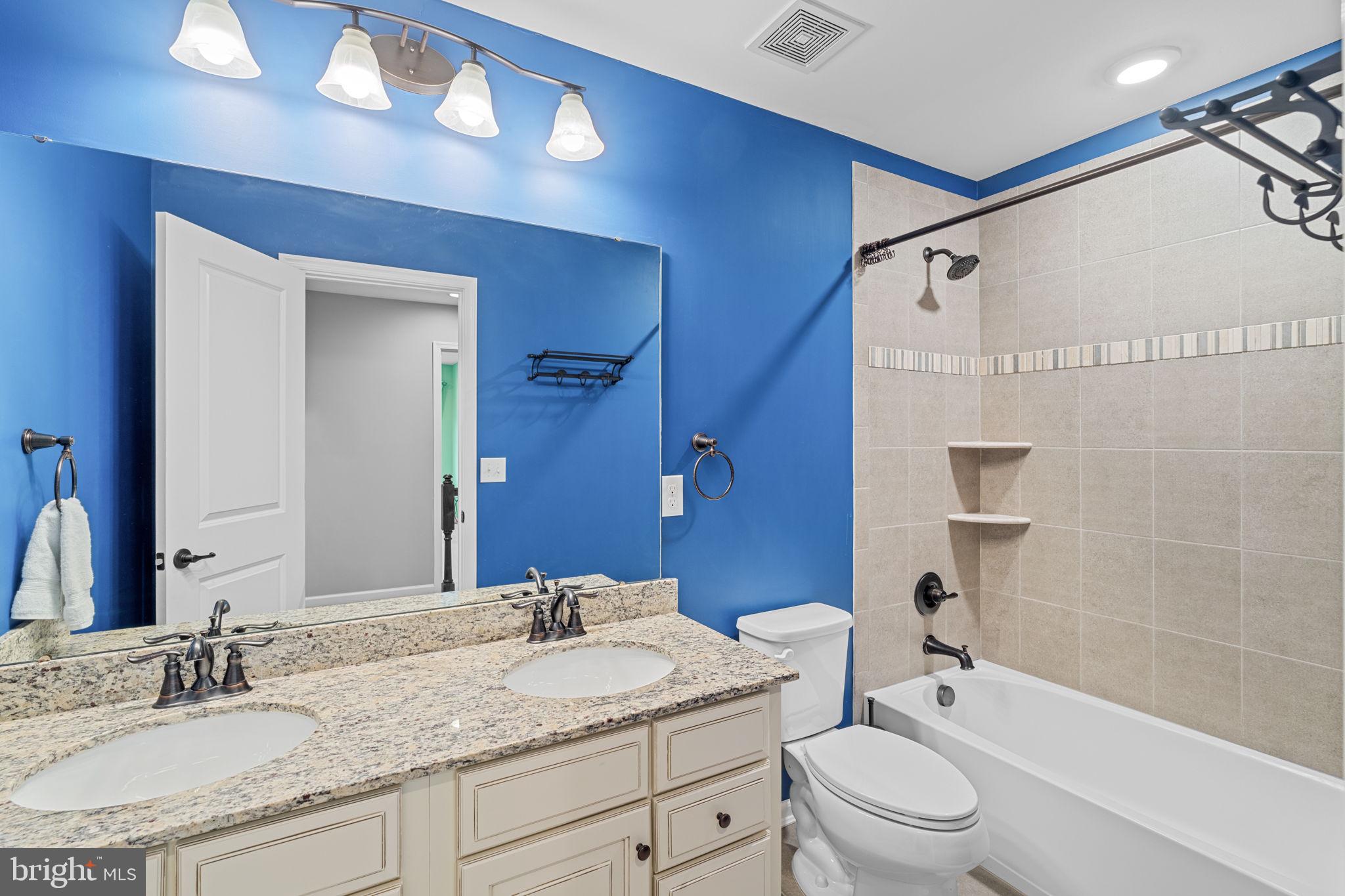 1145 Lynch Circle Warminster, PA 18974 - Photo 46 of 67 a bathroom with a granite countertop sink a toilet and shower