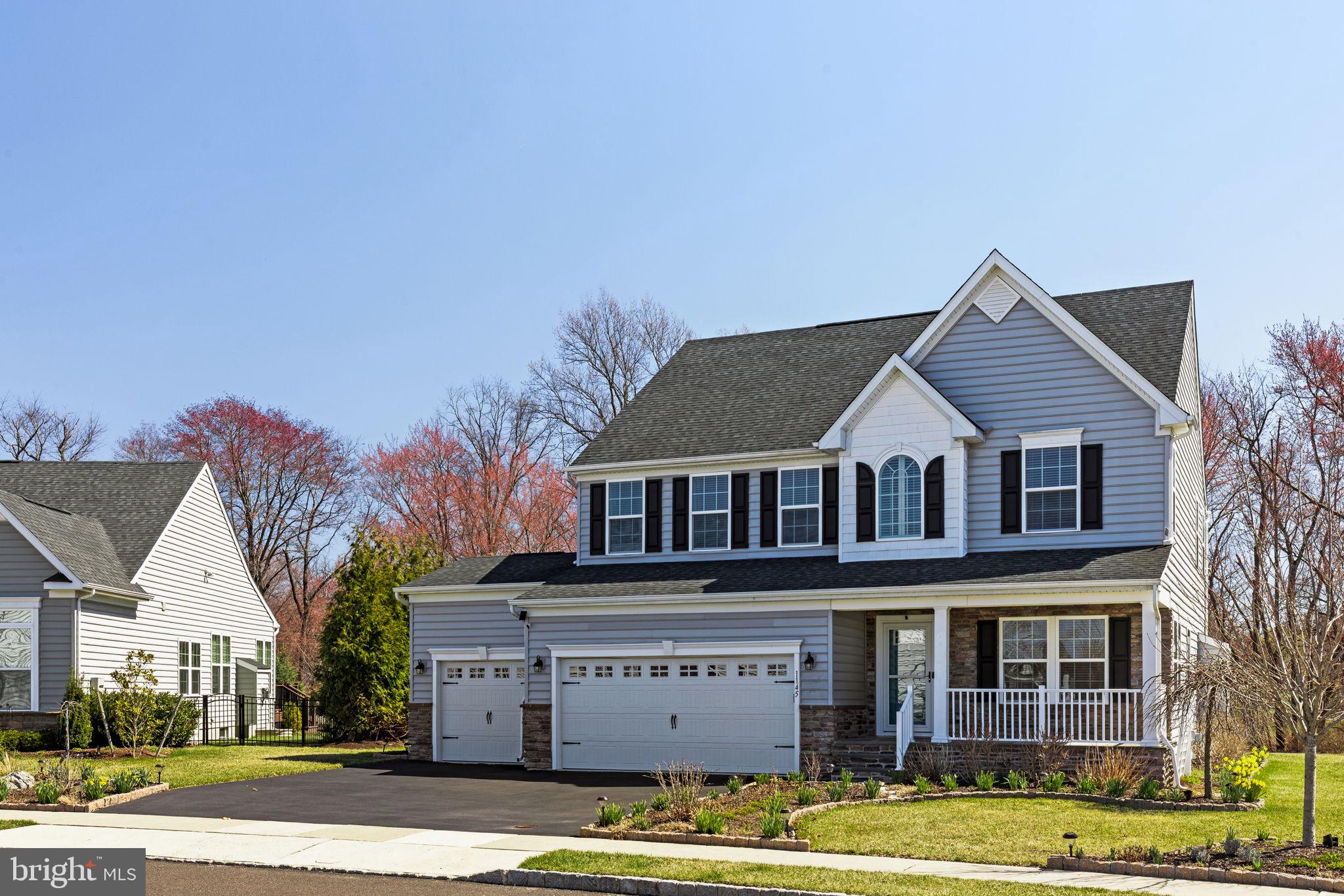 1145 Lynch Circle Warminster, PA 18974 - Photo 5 of 67 a view of a big house with a large windows and large trees