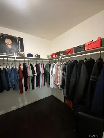 a bedroom with a bed and a ceiling fan