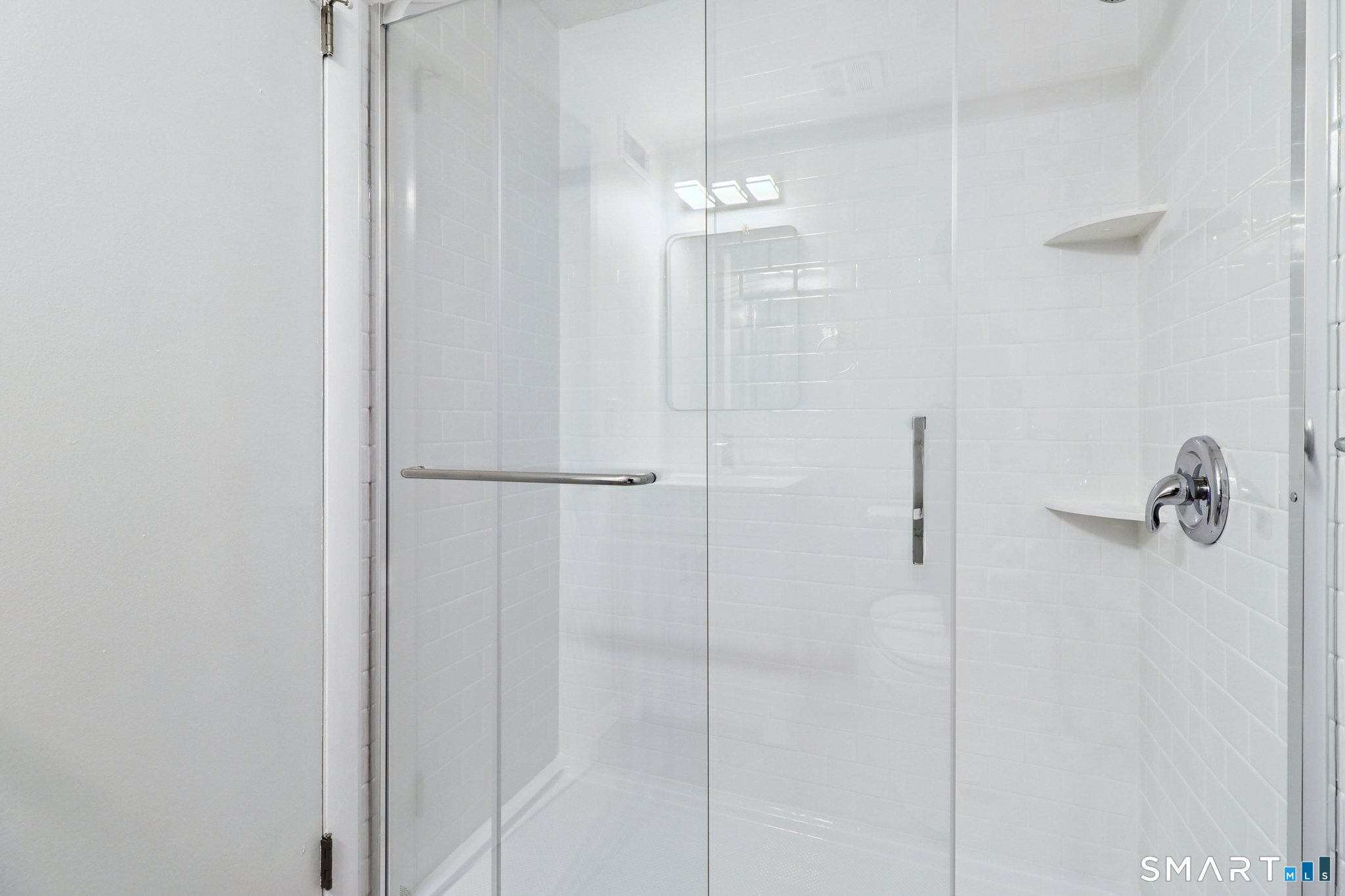 172 Towne House Road, Unit 172 Hamden, CT 06514 - Photo 18 of 20 a bathroom with a shower