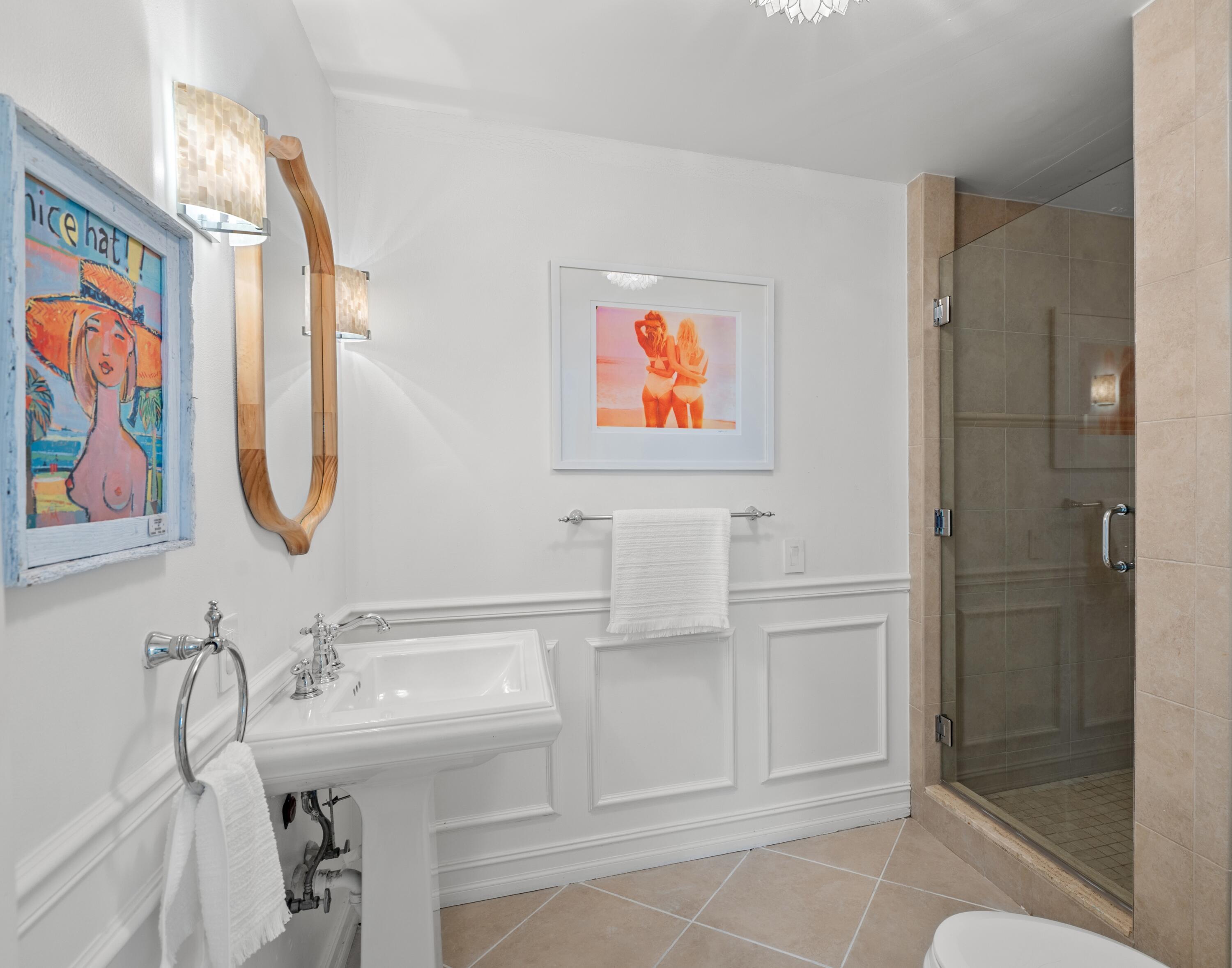 5111 North Ocean Boulevard, Unit A Ocean Ridge, FL 33435 - Photo 15 of 47 a bathroom with a sink and a mirror