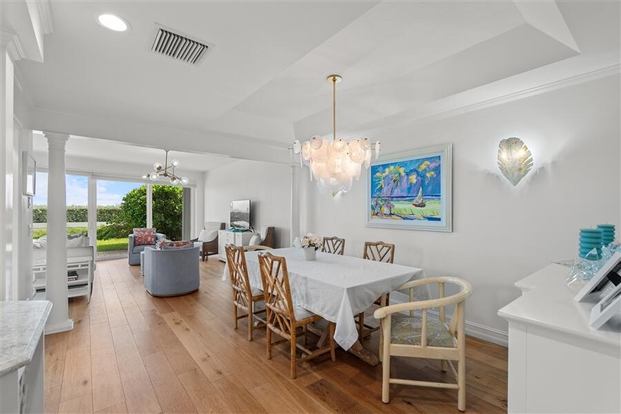 5111 North Ocean Boulevard, Unit A Ocean Ridge, FL 33435 - Photo 16 of 47 a view of a dining room with furniture window and wooden floor