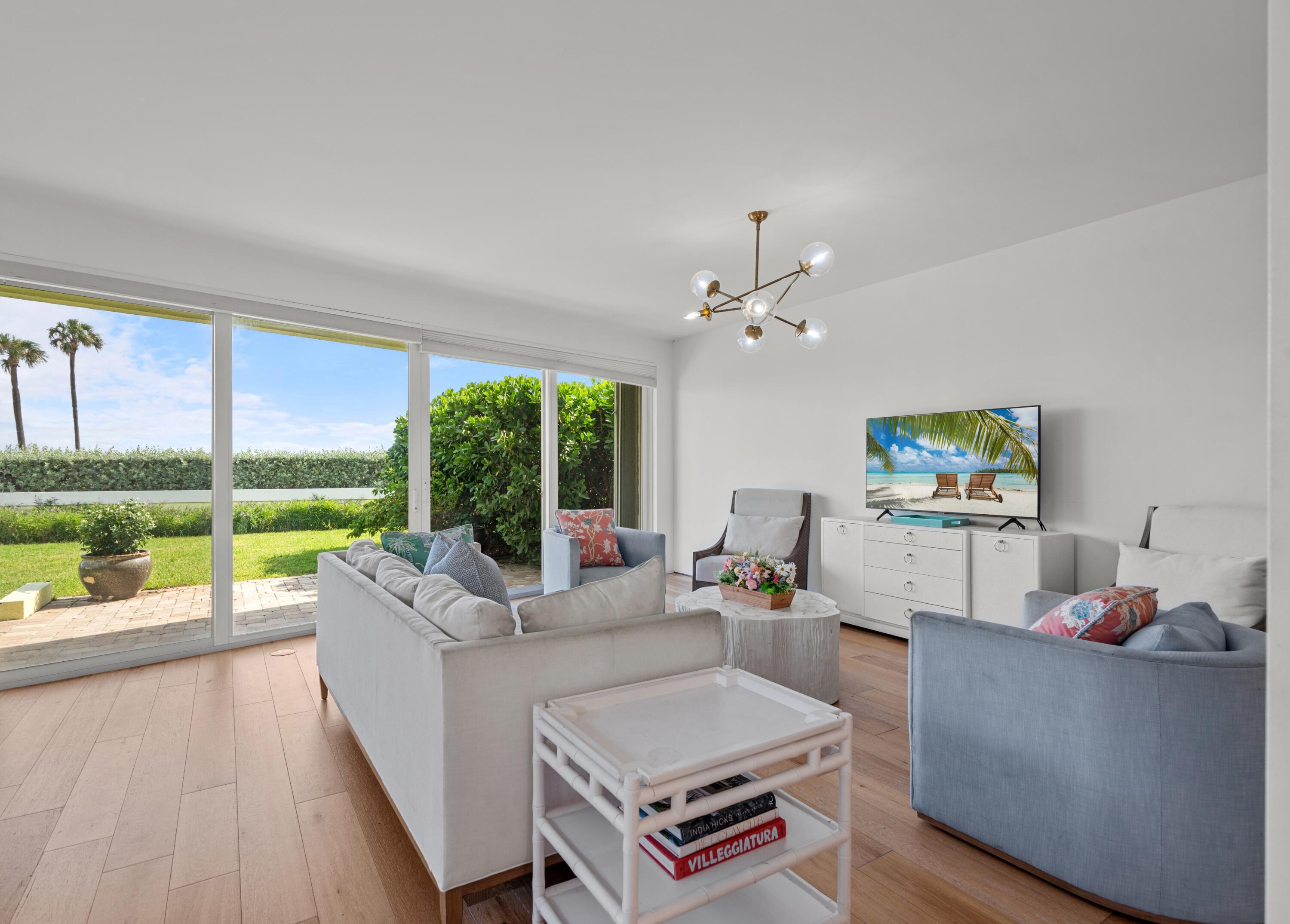 5111 North Ocean Boulevard, Unit A Ocean Ridge, FL 33435 - Photo 23 of 47 a living room with furniture and a large window