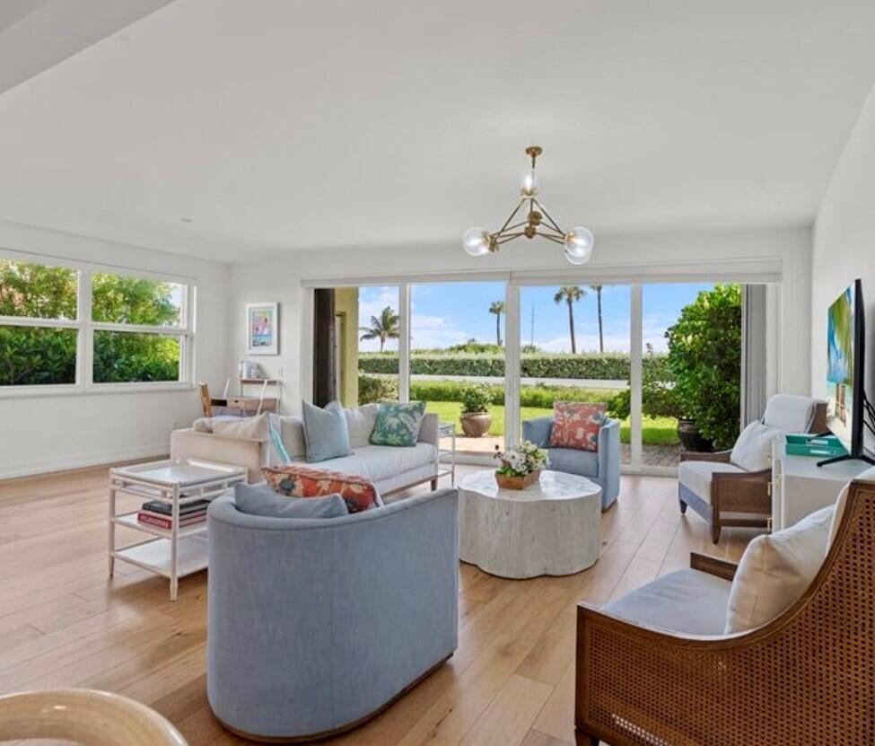 5111 North Ocean Boulevard, Unit A Ocean Ridge, FL 33435 - Photo 24 of 47 a living room with fireplace furniture and a large window