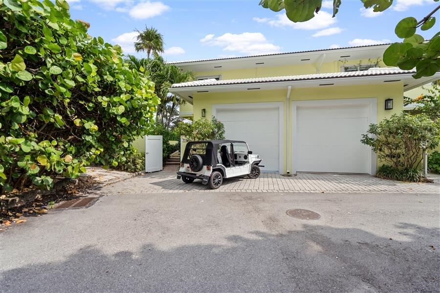 5111 North Ocean Boulevard, Unit A Ocean Ridge, FL 33435 - Photo 10 of 47 a view of a house with potted plants and large tree