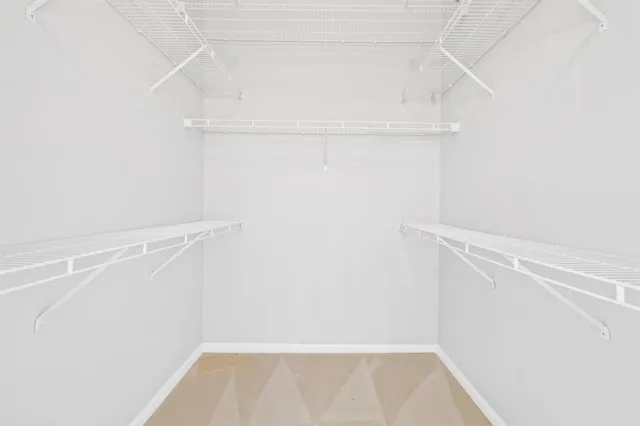 an aerial view of a house with garden space and street view