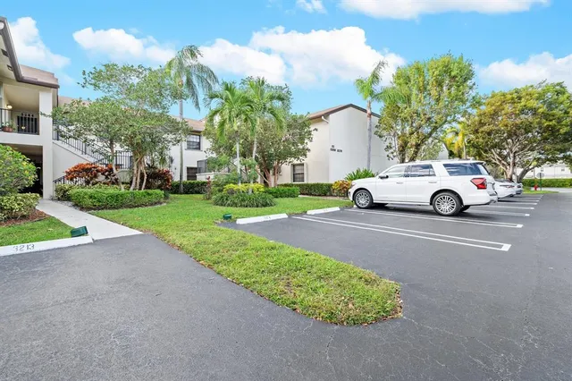 a view of street with parked cars