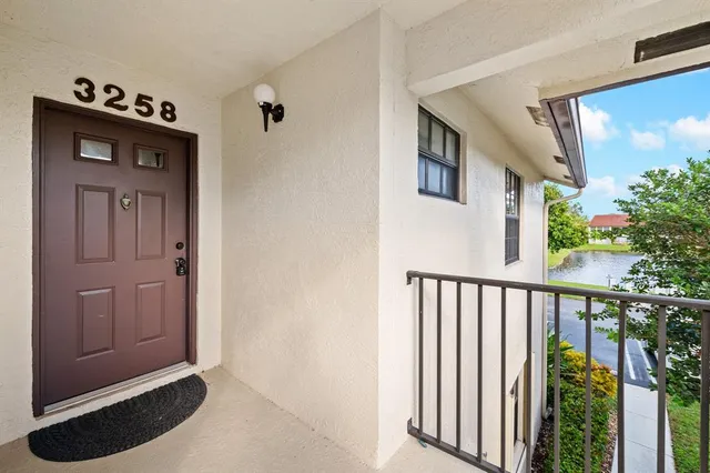 a view of a hallway with entryway door