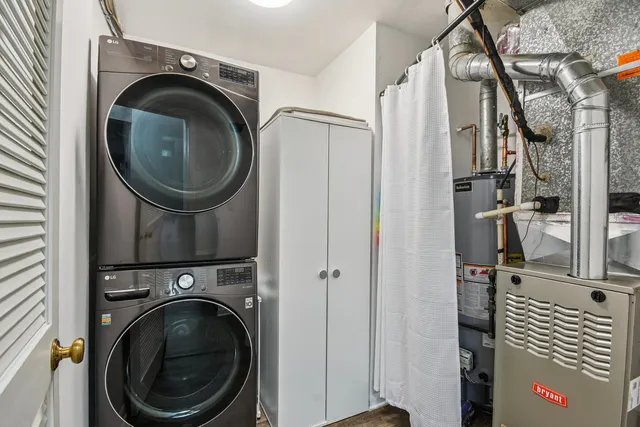 a close view of a utility room with dryer and washer