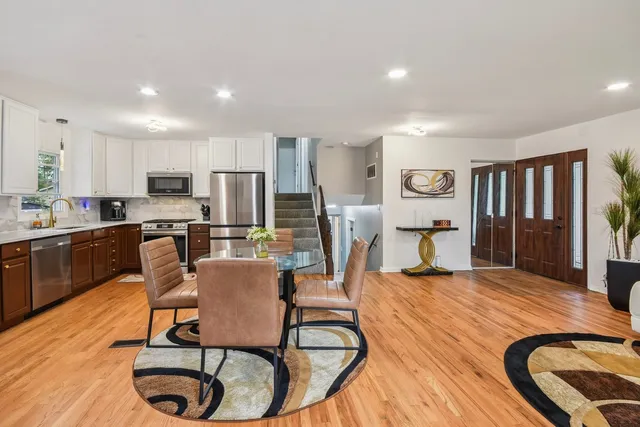 a dining room with furniture and window