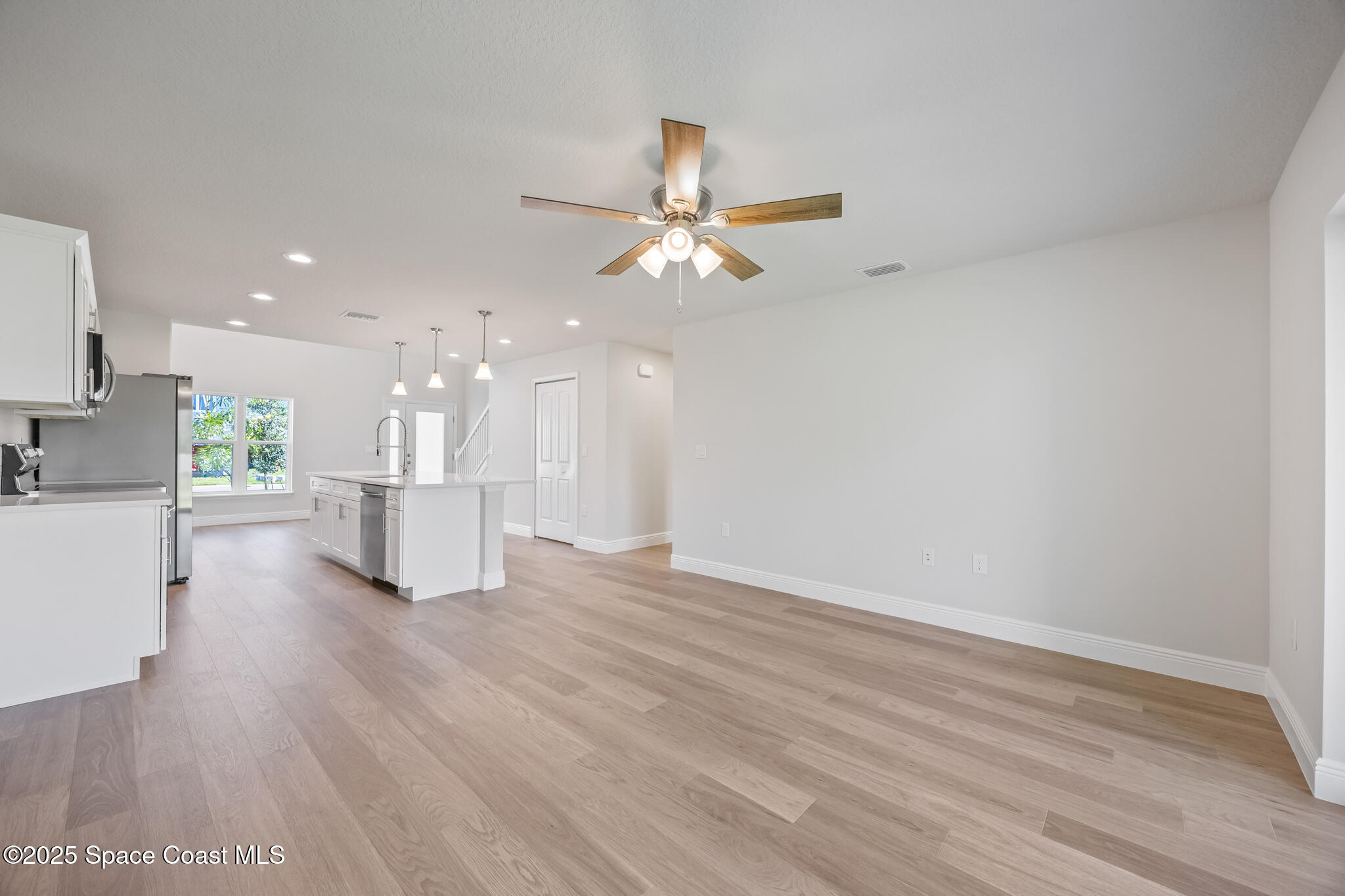 237 Hidden Woods Place Melbourne, FL 32901 - Photo 31 of 31 a view of an empty room with wooden floor