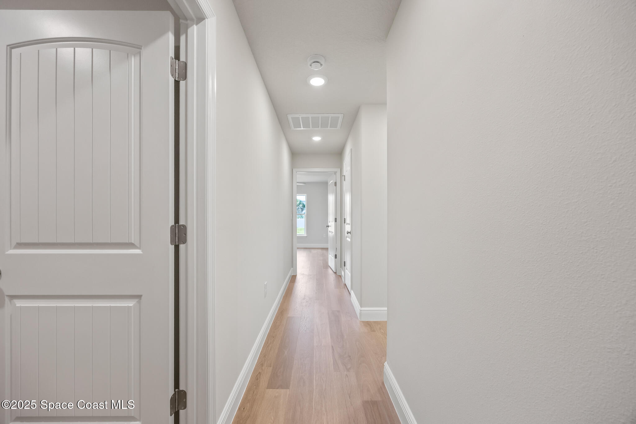 237 Hidden Woods Place Melbourne, FL 32901 - Photo 14 of 31 a view of a hallway with wooden floor
