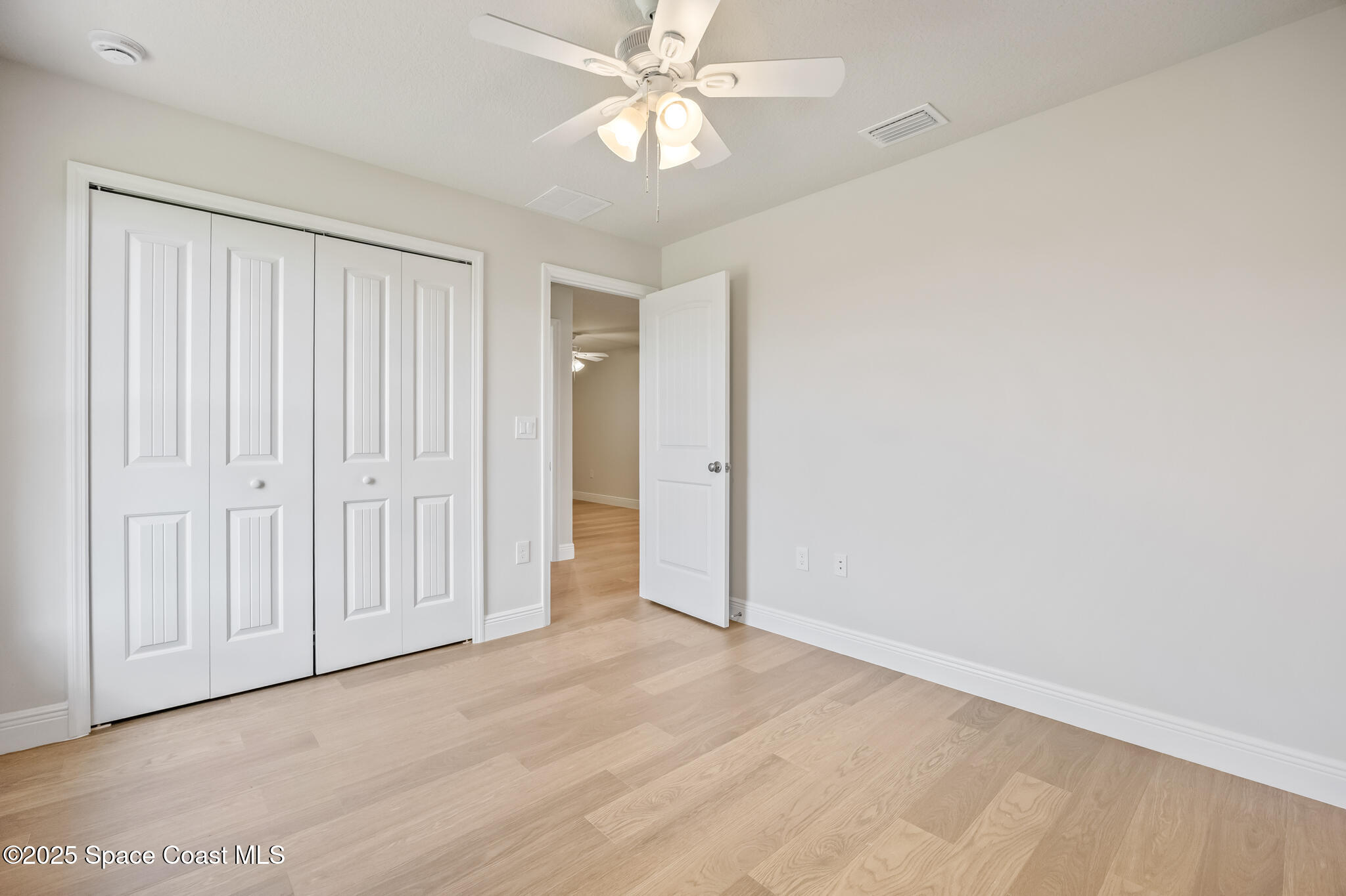 237 Hidden Woods Place Melbourne, FL 32901 - Photo 25 of 31 a view of an empty room and chandelier fan