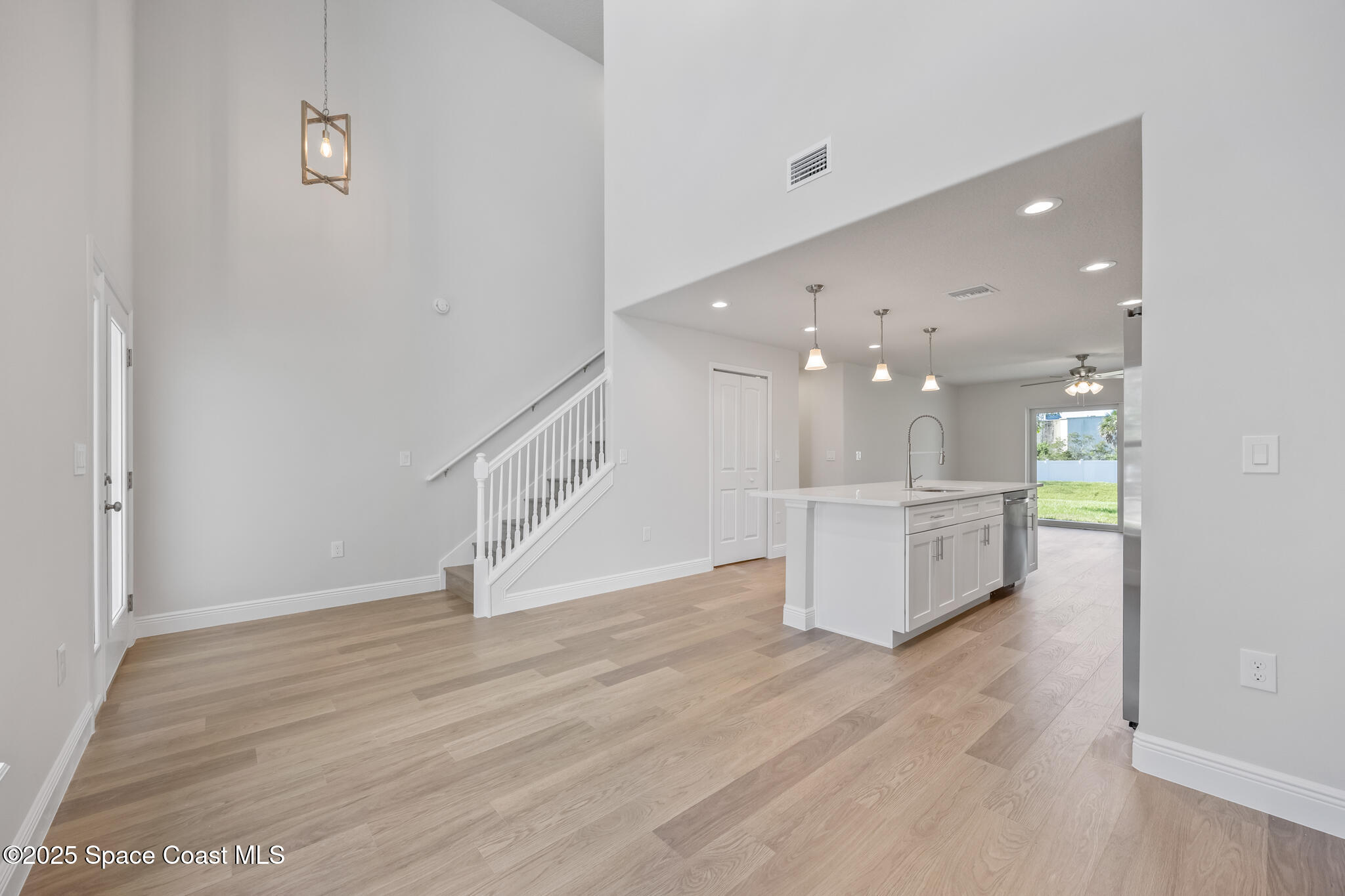 237 Hidden Woods Place Melbourne, FL 32901 - Photo 4 of 31 a view of a hallway with wooden floor
