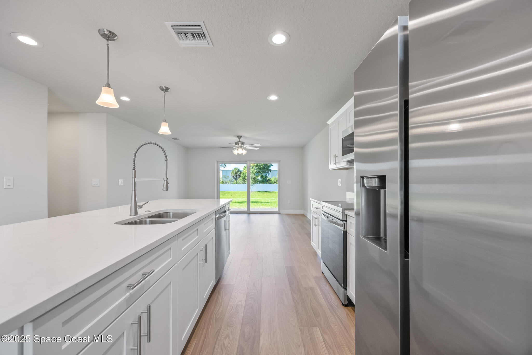 237 Hidden Woods Place Melbourne, FL 32901 - Photo 8 of 31 a bathroom with a sink a large mirror and a shower