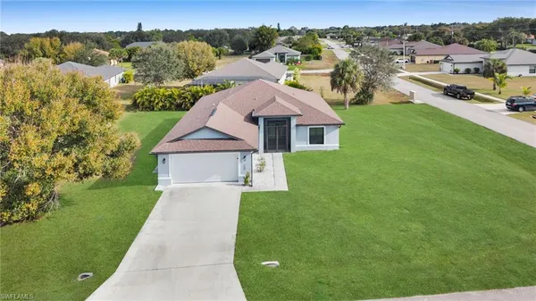 a view of a house with a big yard