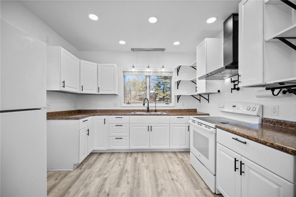 685 Herman Road Butler, PA 16002 - Photo 15 of 43 a kitchen with a sink window and cabinets