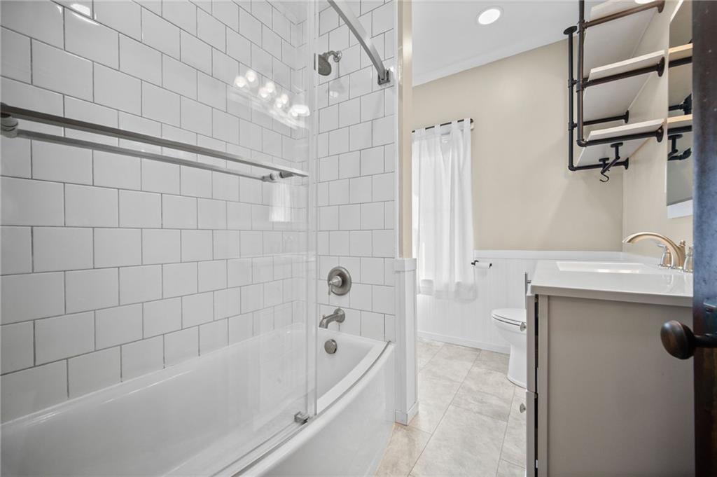 685 Herman Road Butler, PA 16002 - Photo 20 of 43 a bathroom with a tub a sink and a shower