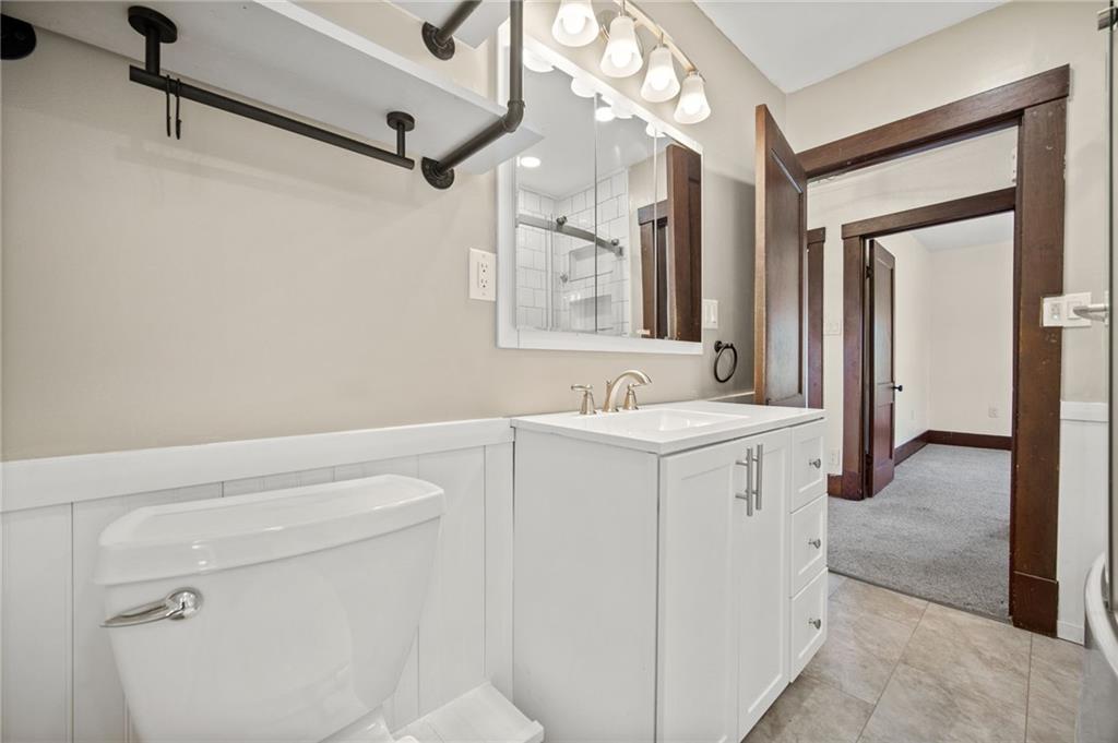685 Herman Road Butler, PA 16002 - Photo 21 of 43 a bathroom with a sink a vanity and a mirror