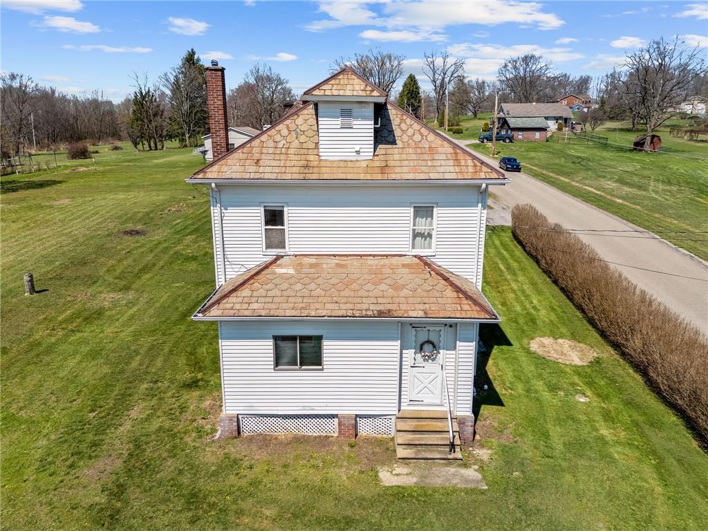 685 Herman Road Butler, PA 16002 - Photo 35 of 43 a aerial view of a house next to a yard with big trees