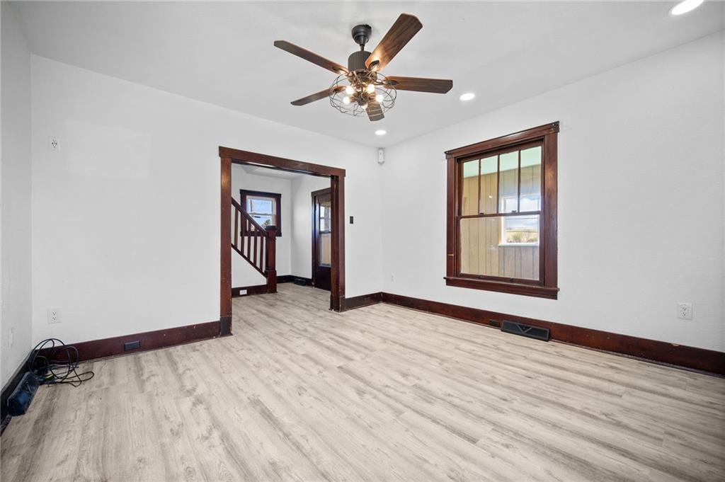 685 Herman Road Butler, PA 16002 - Photo 8 of 43 a view of an empty room with wooden floor and a window