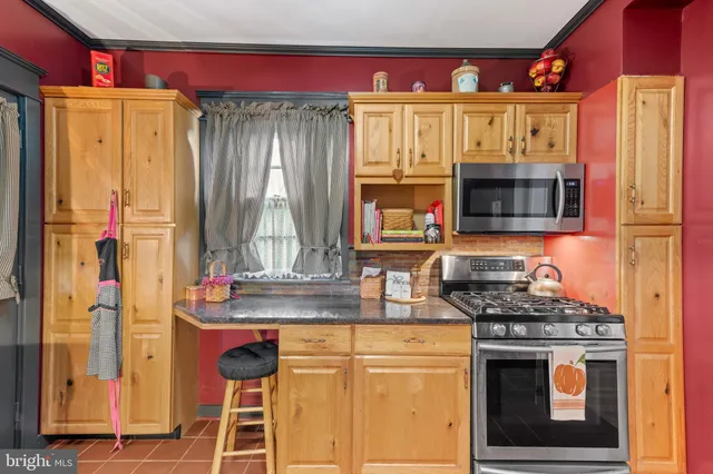 a kitchen with stainless steel appliances granite countertop a sink and cabinets