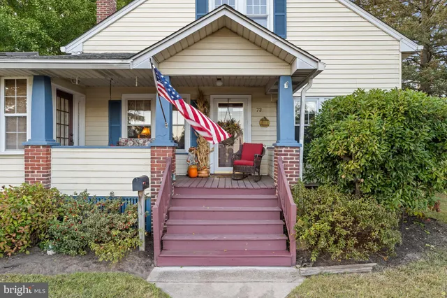 a front view of a house with a porch