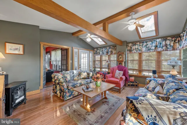 a large kitchen with stainless steel appliances granite countertop a stove and a refrigerator