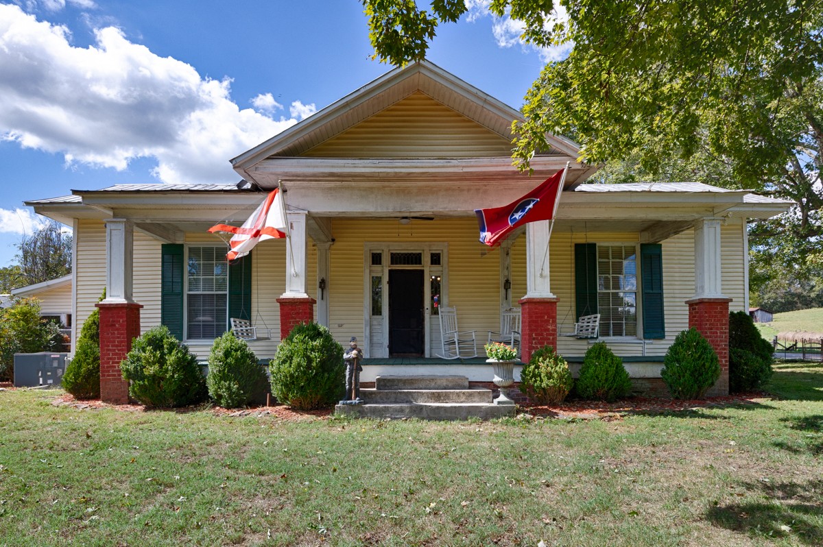 395 Case Road Prospect, TN 38477 - Photo 1 of 48 a view of a house with potted plants and a table
