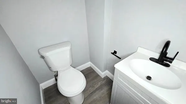 a bathroom with a toilet and sink