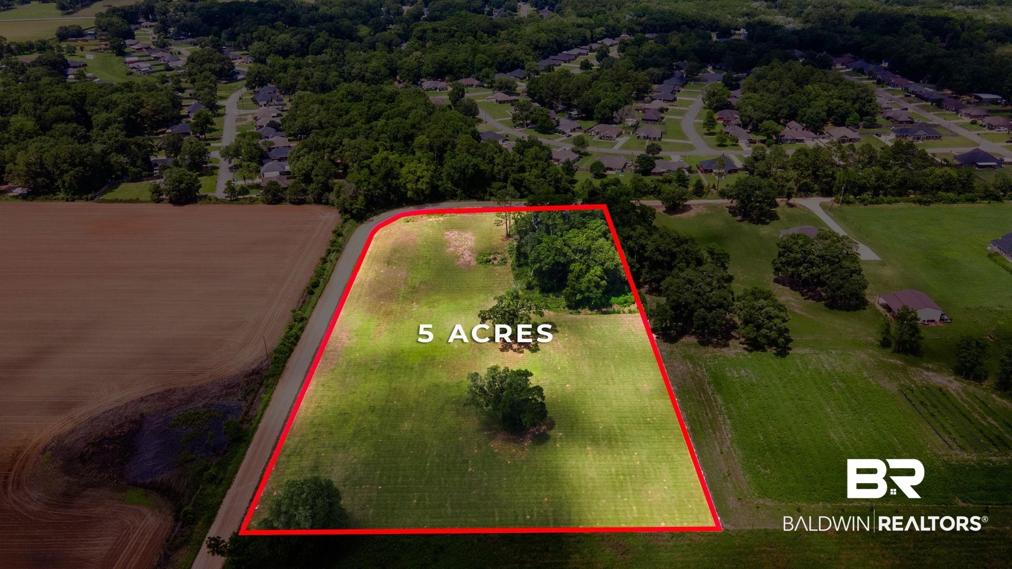 0 Wear Road Grand Bay, AL 36541 - Photo 1 of 3 Aerial perspective of suburban area with property parcel outlined
